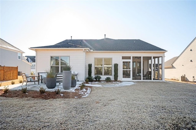 rear view of property with a patio area, a sunroom, and central air condition unit