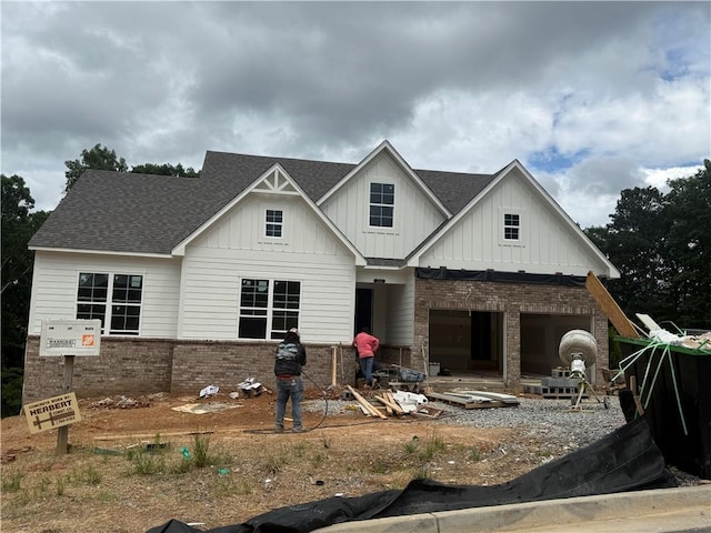 202 Willow St, Canton, GA 30114 - view of front of property featuring brick siding, board and batten siding, and roof with shingles