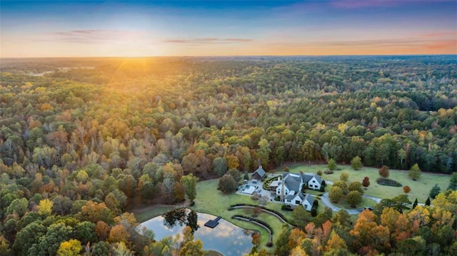 aerial view at dusk with a water view