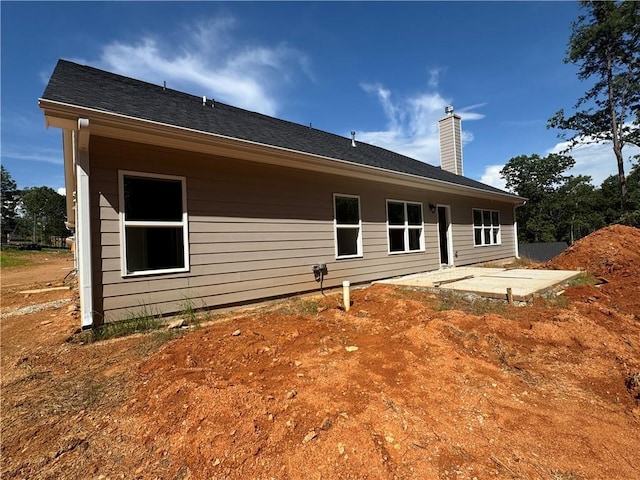 5381 Tuscany Dr, Douglasville, GA 30135 - rear view of house featuring a chimney and a patio