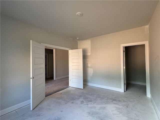 5381 Tuscany Dr, Douglasville, GA 30135 - unfurnished bedroom with unfinished concrete flooring and a closet
