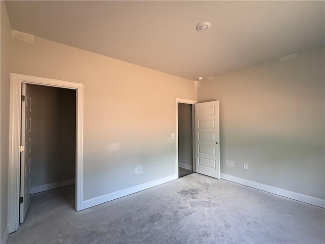5381 Tuscany Dr, Douglasville, GA 30135 - unfurnished bedroom featuring concrete floors and baseboards