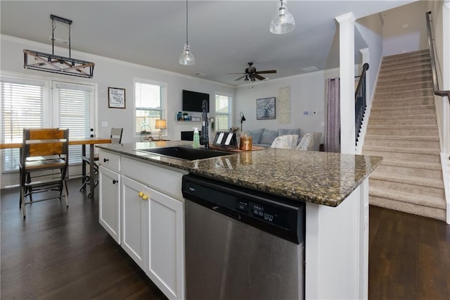 kitchen featuring dishwasher, dark wood-type flooring, ornamental molding, and open floor plan