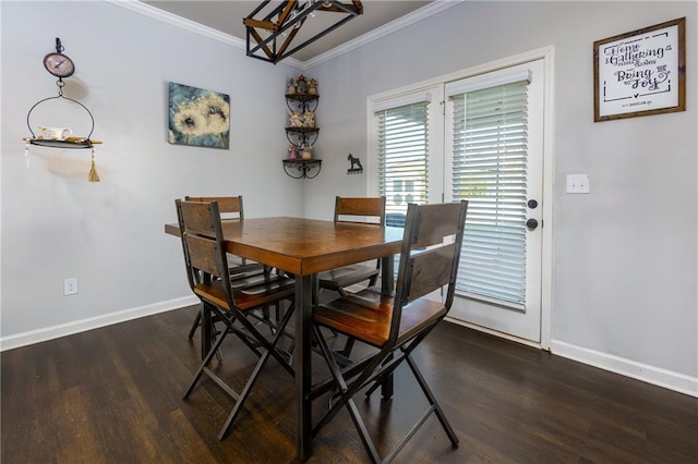 dining space with baseboards, dark wood-type flooring, and crown molding