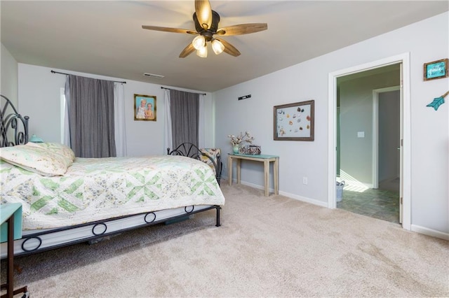 carpeted bedroom featuring visible vents and baseboards