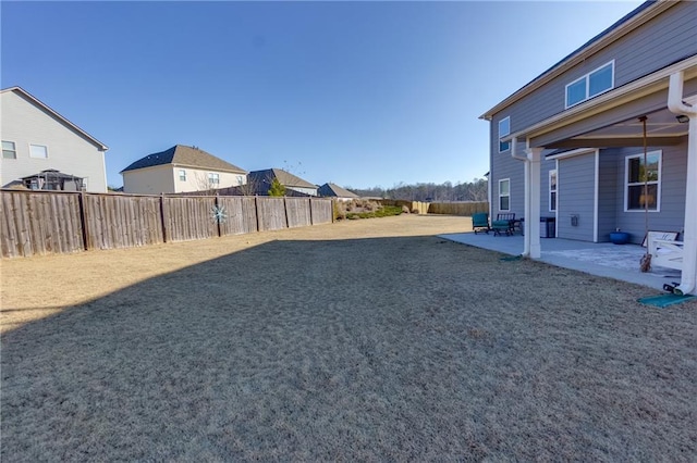 view of yard featuring a patio area and fence