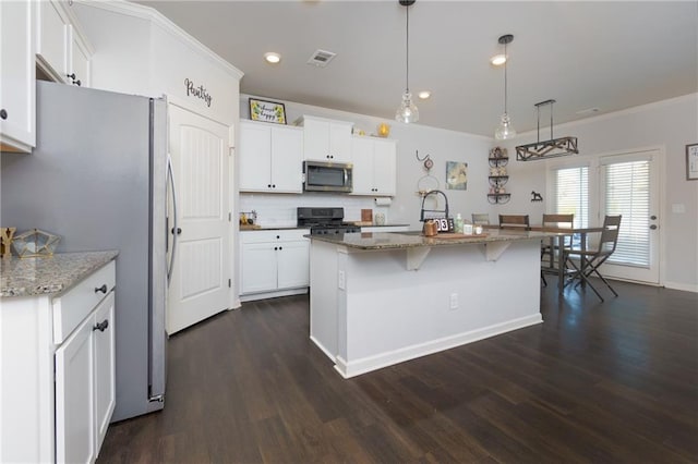 kitchen featuring visible vents, white cabinets, appliances with stainless steel finishes, dark wood-style floors, and crown molding