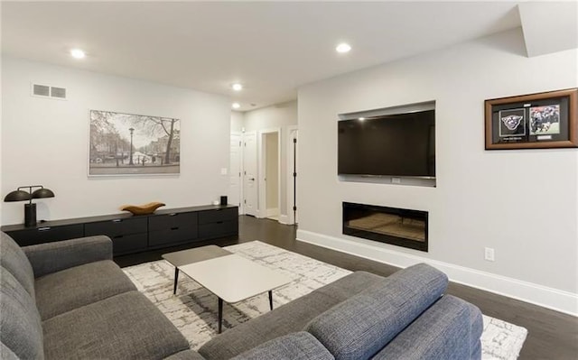 living room with dark hardwood / wood-style flooring