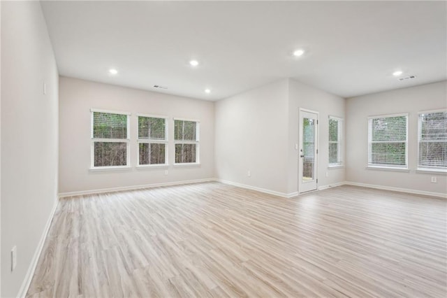 spare room featuring light hardwood / wood-style flooring