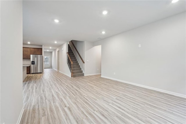 unfurnished living room featuring light hardwood / wood-style flooring