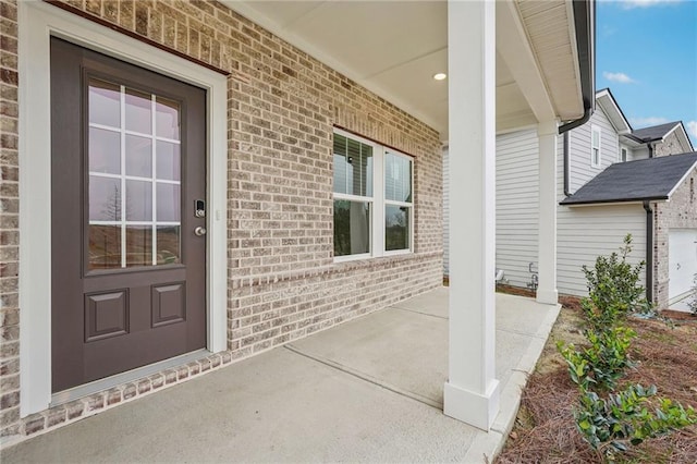 doorway to property featuring covered porch