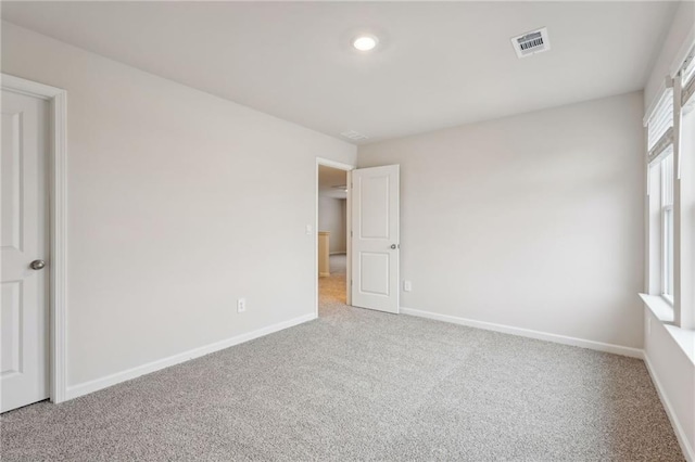 empty room with carpet flooring