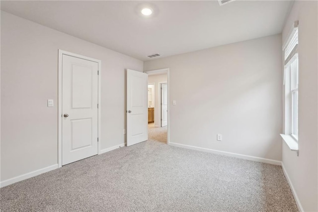 unfurnished bedroom featuring carpet flooring