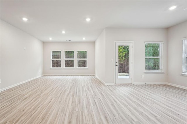 unfurnished living room with light hardwood / wood-style flooring