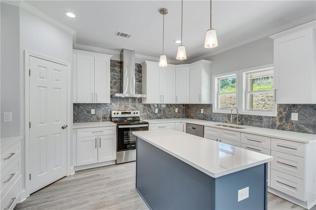 1226 Bloomsbury Ln, Gainesville, GA 30501 - kitchen with stainless steel appliances, wall chimney exhaust hood, a sink, ornamental molding, and white cabinetry