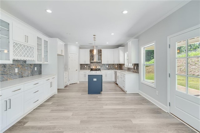 1226 Bloomsbury Ln, Gainesville, GA 30501 - kitchen with a sink, stainless steel appliances, wall chimney range hood, ornamental molding, and tasteful backsplash