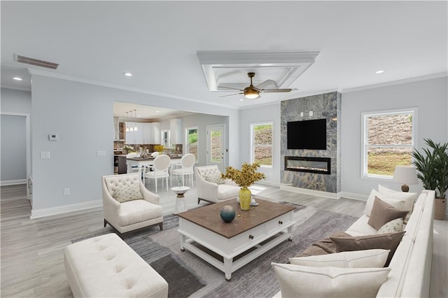 1226 Bloomsbury Ln, Gainesville, GA 30501 - living room featuring crown molding, light wood-style flooring, recessed lighting, a ceiling fan, and baseboards