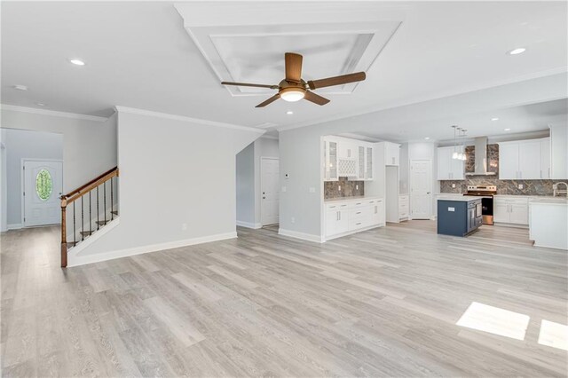 1226 Bloomsbury Ln, Gainesville, GA 30501 - unfurnished living room featuring a sink, a ceiling fan, crown molding, light wood-style floors, and baseboards