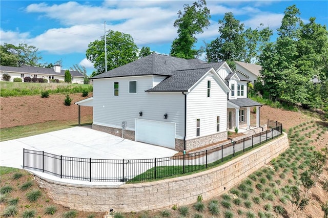 1226 Bloomsbury Ln, Gainesville, GA 30501 - view of property exterior featuring a garage, concrete driveway, stone siding, and a shingled roof