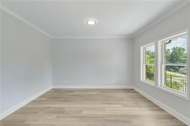 1226 Bloomsbury Ln, Gainesville, GA 30501 - spare room featuring crown molding, light wood-style floors, and baseboards