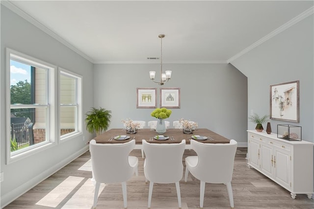 1226 Bloomsbury Ln, Gainesville, GA 30501 - dining room featuring a chandelier, light wood finished floors, baseboards, and ornamental molding