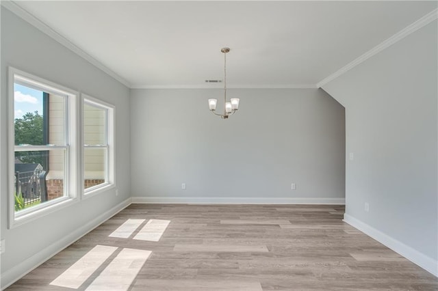 1226 Bloomsbury Ln, Gainesville, GA 30501 - unfurnished dining area featuring a chandelier, ornamental molding, light wood-type flooring, and baseboards