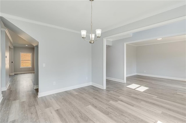 1226 Bloomsbury Ln, Gainesville, GA 30501 - empty room featuring a chandelier, crown molding, light wood-type flooring, and baseboards