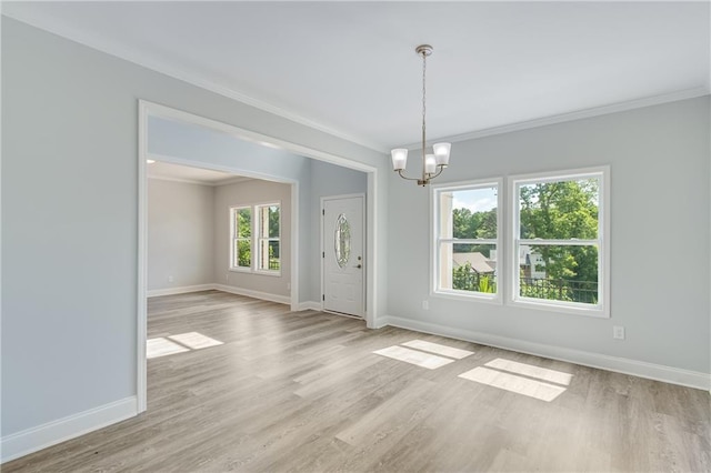 1226 Bloomsbury Ln, Gainesville, GA 30501 - unfurnished room with baseboards, light wood-style flooring, ornamental molding, and a chandelier