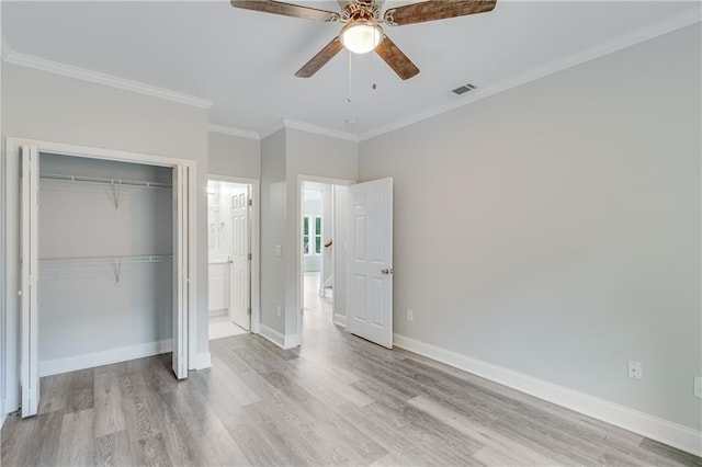 1226 Bloomsbury Ln, Gainesville, GA 30501 - unfurnished bedroom with light wood-style floors, a closet, crown molding, baseboards, and a ceiling fan