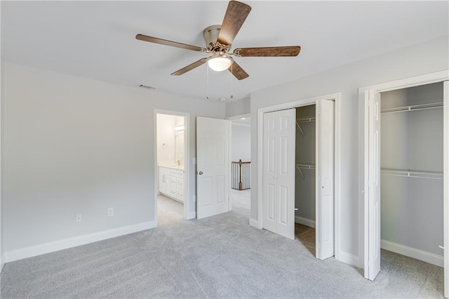 1226 Bloomsbury Ln, Gainesville, GA 30501 - unfurnished bedroom with two closets, carpet, baseboards, and ceiling fan