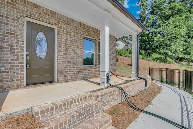 1226 Bloomsbury Ln, Gainesville, GA 30501 - view of exterior entry with a porch and brick siding