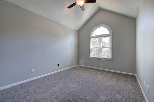 11 Trotters Walk NE, Cartersville, GA 30121 - spare room with ceiling fan, a textured ceiling, carpet floors, vaulted ceiling, and baseboards