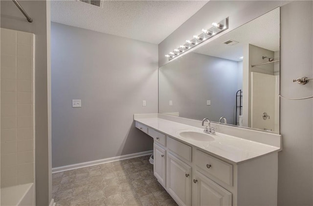 11 Trotters Walk NE, Cartersville, GA 30121 - bathroom with vanity, a textured ceiling, baseboards, and shower / tub combination