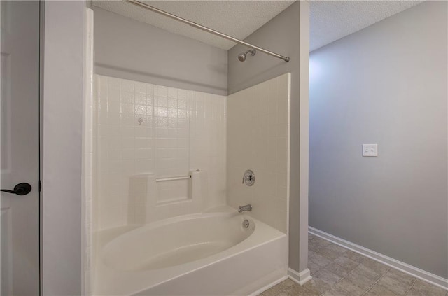 11 Trotters Walk NE, Cartersville, GA 30121 - bathroom featuring shower / bathtub combination, a textured ceiling, and baseboards