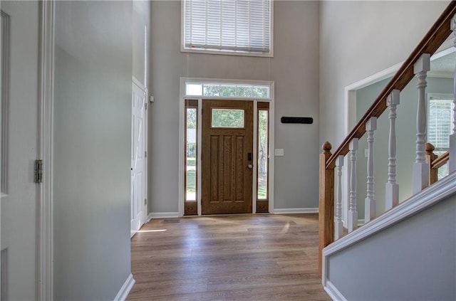 11 Trotters Walk NE, Cartersville, GA 30121 - entrance foyer featuring a high ceiling, wood finished floors, healthy amount of natural light, stairway, and baseboards