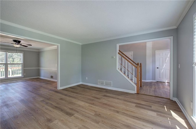 11 Trotters Walk NE, Cartersville, GA 30121 - unfurnished room featuring stairs, wood finished floors, ceiling fan, crown molding, and baseboards