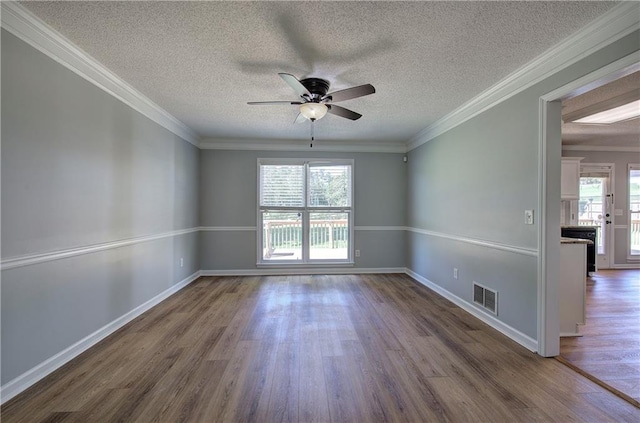 11 Trotters Walk NE, Cartersville, GA 30121 - empty room with wood finished floors, ceiling fan, baseboards, a textured ceiling, and ornamental molding