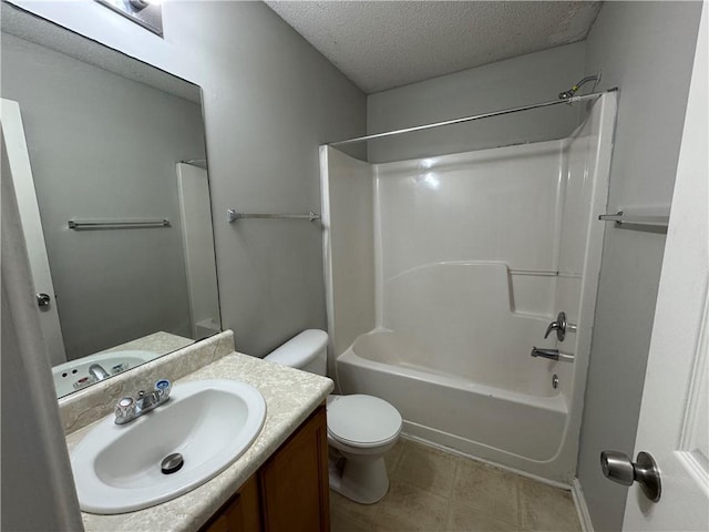 full bathroom with shower / washtub combination, vanity, a textured ceiling, and toilet