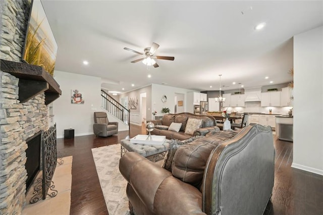 130 W Pier Way, Fayetteville, GA 30214 - living room with ceiling fan, baseboards, recessed lighting, a stone fireplace, and dark wood-type flooring