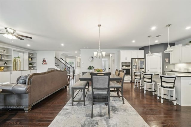 130 W Pier Way, Fayetteville, GA 30214 - dining area featuring dark wood-style floors, recessed lighting, a chandelier, a ceiling fan, and stairway
