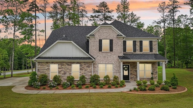 130 W Pier Way, Fayetteville, GA 30214 - craftsman-style home with board and batten siding, a front lawn, a shingled roof, and stone siding