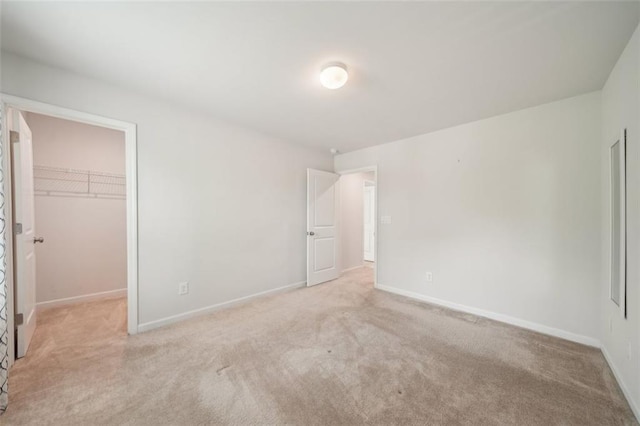 130 W Pier Way, Fayetteville, GA 30214 - unfurnished bedroom with carpet flooring, a walk in closet, and baseboards