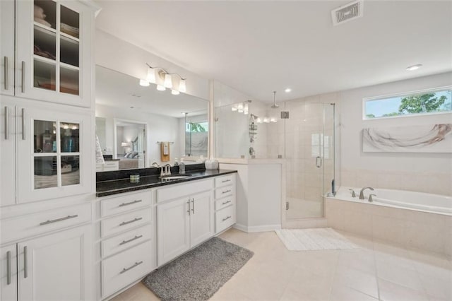 130 W Pier Way, Fayetteville, GA 30214 - ensuite bathroom featuring a stall shower, a garden tub, vanity, and tile patterned flooring
