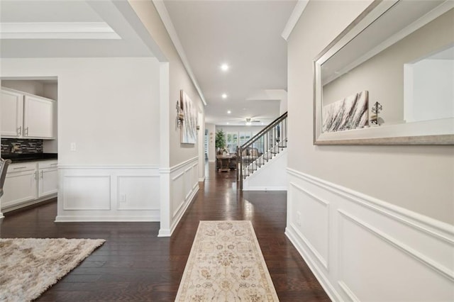 130 W Pier Way, Fayetteville, GA 30214 - hallway with stairway, wainscoting, recessed lighting, dark wood-style flooring, and a decorative wall