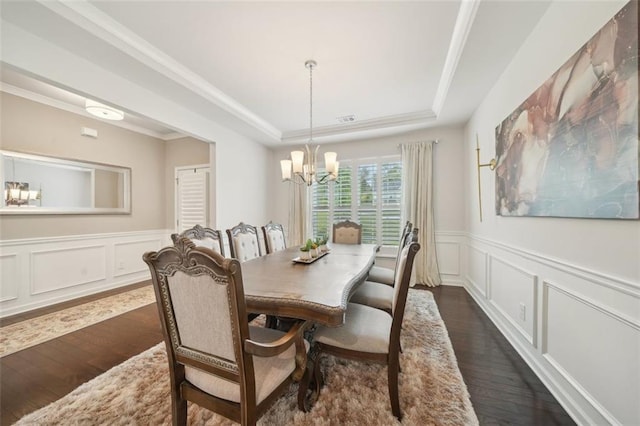 130 W Pier Way, Fayetteville, GA 30214 - dining room featuring a tray ceiling, dark wood finished floors, a chandelier, a decorative wall, and a wainscoted wall