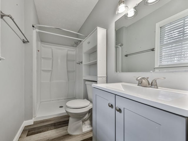 525 Henson Cir, Carrollton, GA 30117 - full bathroom with a shower, wood finished floors, vanity, and toilet