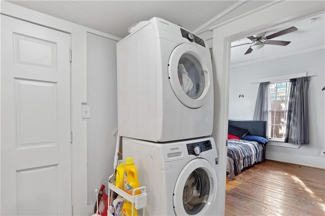 1081 Longley Ave NW, Atlanta, GA 30318 - clothes washing area featuring a ceiling fan, ornamental molding, wood-type flooring, laundry area, and stacked washer / drying machine