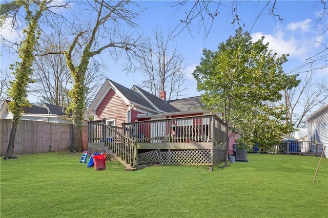 1081 Longley Ave NW, Atlanta, GA 30318 - back of property with a yard, a chimney, a wooden deck, and a fenced backyard