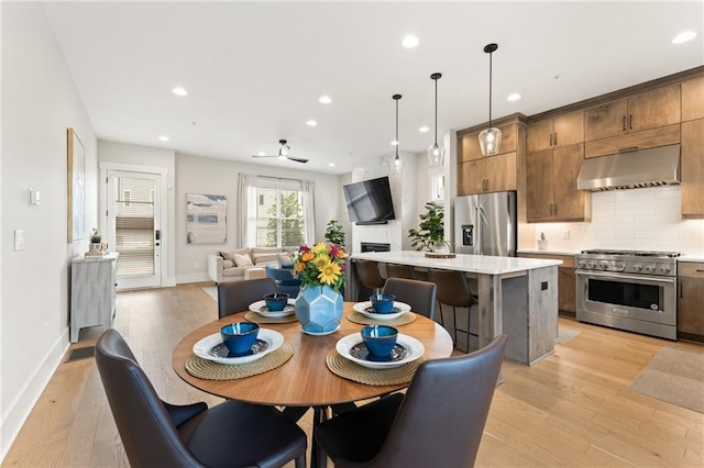 dining room with light wood-type flooring