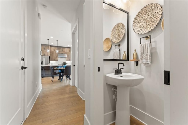 bathroom with wood-type flooring